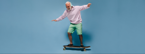 Senior male balancing on a skateboard